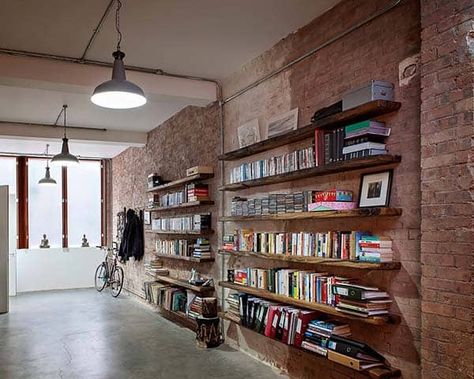 Shoreditch Warehouse Conversion by Chris Dyson Architects Steel Frame Doors, Modern Warehouse, Warehouse Conversion, Bookshelves In Bedroom, Modern Shed, Library Shelves, Exposed Brick Walls, Loft Living, Industrial Shelving