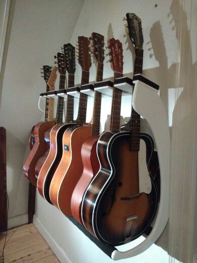 Even more guitar rack Guitar Rack Wall, Diy Guitar Rack, Guitar Storage Ideas, Guitar Display Ideas, Guitar Storage Cabinet, Guitar Storage, Guitar Display, Home Music Rooms, Guitar Rack