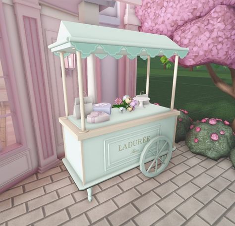 City Aesthetic Bloxburg, Cute Bloxburg Exterior, Bloxburg Market Stall, Bloxburg Flower Stand, Bloxburg Ice Cream Stand, Ice Cream Store Bloxburg, Bloxburg Ice Cream Truck, Bakery With Apartment Above, Small City Layout