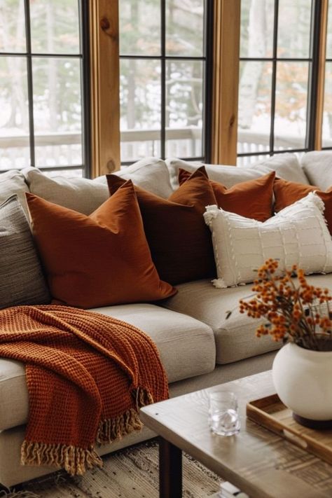 Orange Rustic Living Room, Burnt Orange Pillows On Grey Couch, Fall Vibes Aesthetic Living Room, Burnt Orange Living Room Accents, Tan And Rust Living Room, Dark Color Decor, Rustic Orange Home Decor, Burnt Orange Apartment Decor, Fall Color Home Decor