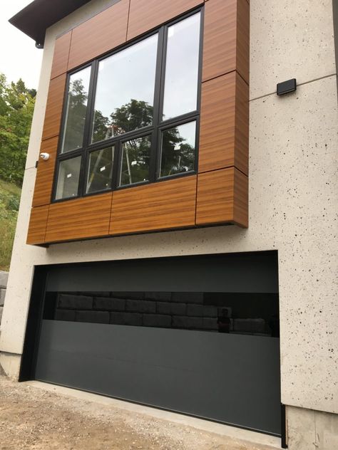 Modern Oversized Black Aluminum Glass Garage Door Batten Garage Door, Modern Parking Garage, Garage Doors Uk, Contemporary Garage Doors, Aluminium Garage Doors, Contemporary Garage, Glass Garage, Aluminum Garage, Ranch House Remodel