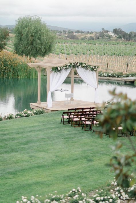 PONTE WINERY WEDDING TEMECULA CALIFORNIA MAKENNA AND JARED Wedding Over Water, Wedding Pond Decorations, Weddings By Water, Winery Wedding Venues California, Outdoor Pond Wedding Ceremony, Water Wedding Venues, Ponte Winery Wedding, Wedding Structures Outdoor, Wedding Overlooking Water