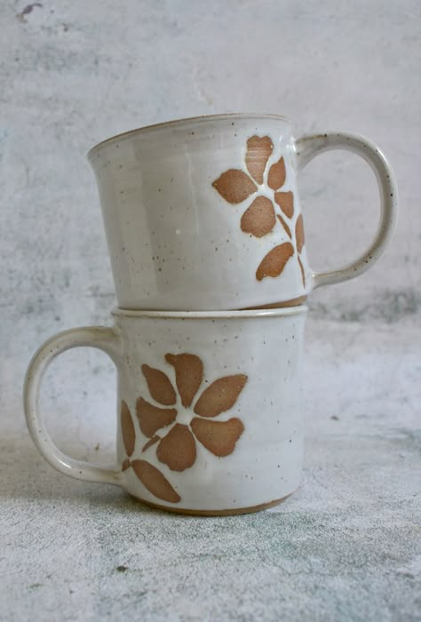 Mug, flower, clay, pottery, white, Simple Ceramic Mug, Wax Resist Pottery Patterns, Mug Glazing Ideas, Ceramic Mug Designs Painted, Wax Resist Pottery, Flower Mugs Pottery, Slab Mug Ideas, Terracotta Mugs, Potery Clay Flowers On A Mug