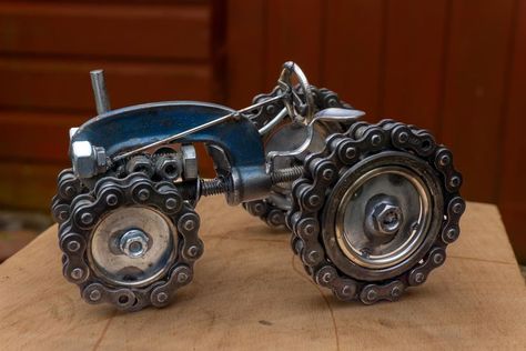 Scrap metal art | I tried making my own G clamp tractor | Facebook Scrap Metal Tractor, Ag Mechanics, Scrap Metal Sculpture, Junk Metal Art, Tractor Art, Silverware Art, Recycled Metal Art, Shop Lights, Motorcycle Chain