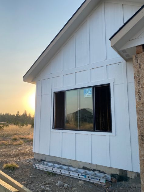 Trim not painted yet Vertical Siding Farmhouse, Vertical Cladding, Exterior Facelift, Quarry House, Hardy Board, Texas Cottage, Vertical Wood Siding, Smurf House, Cabin Remodel