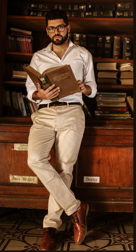 Man Holding Book Pose Reference, Library Photoshoot Ideas Men, Library Photo Shoot Men, Male Librarian, Man Holding Book, Man With Book, Library Shoot, Corporate Headshot Poses, Author Photos