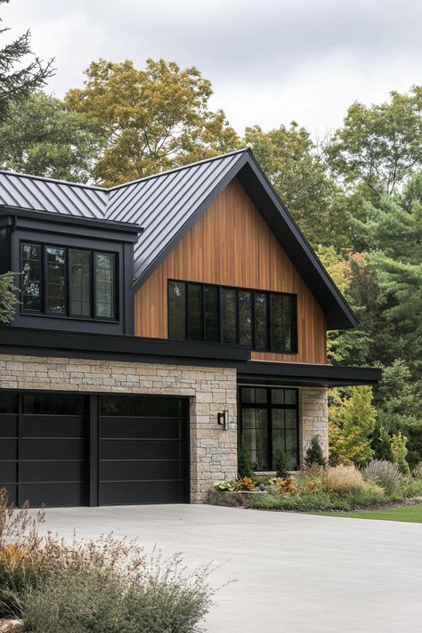 50 Sleek Black Houses That Make a Powerful Statement Dark And Cedar House Exterior, Outside Siding For Houses, Side Split House Exterior Remodel, Dark Gray Siding With Cedar Accents, Dark Brown Board And Batten Siding, Dark Exterior Modern Farmhouse, Grey House Black Trim Wood Accents, Black Hardy Board Exterior, Contemporary Farmhouse Exterior Design