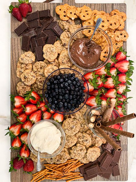 homemade cookies, strawberries, blueberries, Nutella, chocolate, and pretzels! Chocolate And Berries Charcuterie Board, Chocolate Strawberry Charcuterie Board, Nutella Board Ideas, Pretzel Charcuterie Board Ideas, Strawberry Charcuterie Board, Nutella Board, Chocolate And Pretzels, Dessert Charcuterie Board, Nutella Snacks