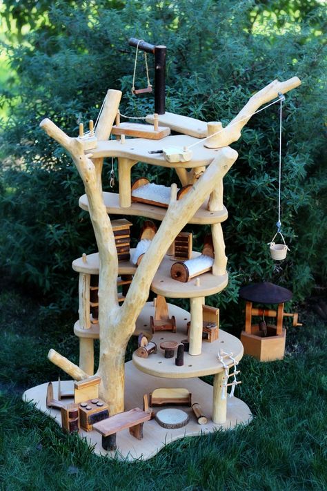 Beautiful and rugged handmade, hand-carved treehouse. 5-stories to play with, including pulleys for playful functionality and lots of delightful furniture! More photos on this link: http://castleofcostamesa.com/waldorf-days/the-waldorf-school-of-orange-county-2013-annual-gala-auction/wooden-tree-house-with-furniture-set Waldorf Doll House, Wooden Tree House, Fairy Tree Houses, Magic Fairy, Waldorf School, Magic Treehouse, Fairy Tree, Woodworking For Kids, Small World Play