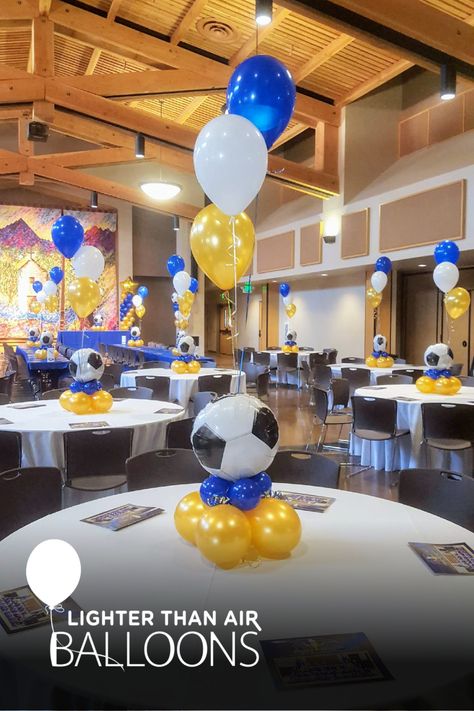 3pc balloon bouquet attached to a low-profile balloon centerpiece with a soccer ball topper for a high school senior night banquet. Soccer Centerpieces, Soccer Senior Night, Soccer Banquet, Soccer Theme Parties, Balloon Table Centerpieces, Banquet Centerpieces, Sports Banquet, Soccer Birthday Parties, Soccer Theme