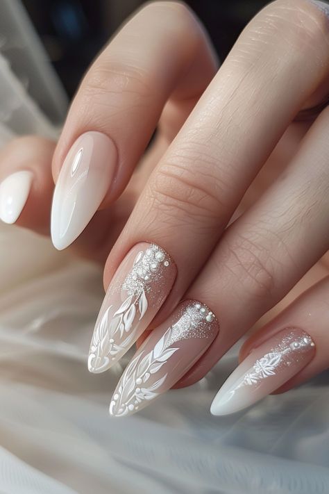 Discover over 60 stunning and sophisticated nail designs perfect for brides in 2024. Elevate your bridal look with these elegant ideas that will make your hands stand out on your special day. From classic French tips to intricate lace patterns, find the perfect inspiration for your wedding nails here. Whether you prefer a timeless and minimalistic style or something more ornate and glamorous, these designs cater to various tastes. Get ready to walk down the aisle with beautifully manicured nails Nails Special Ideas, Nail For Wedding The Bride, Garden Wedding Nails For Bride, Nail Design For Wedding The Bride, Wedding Nails Lace Design, Long Bride Nails, Outdoor Wedding Nails, Wedding Nails Crome, Nail For Bride Wedding