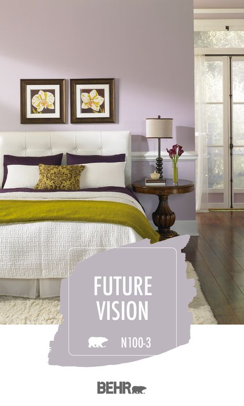 Talk about serious bedroom goals! A new coat of Behr Paint in Future Vision is the perfect way to tie this room together. This light purple wall color pairs beautifully with the neutral pops of white, wood floors, and green accent colors in this space. Click below for full color details to learn more. Bedroom Wall Colors Purple, Purple Wall Color Bedroom, Purple Grey Paint Color Bedroom, Light Purple Accent Wall, Light Purple Walls Bedroom, Behr Purple Paint Colors, Neutral Purple Paint, Purple Gray Paint Behr, Behr Purple Paint Colors Bedrooms