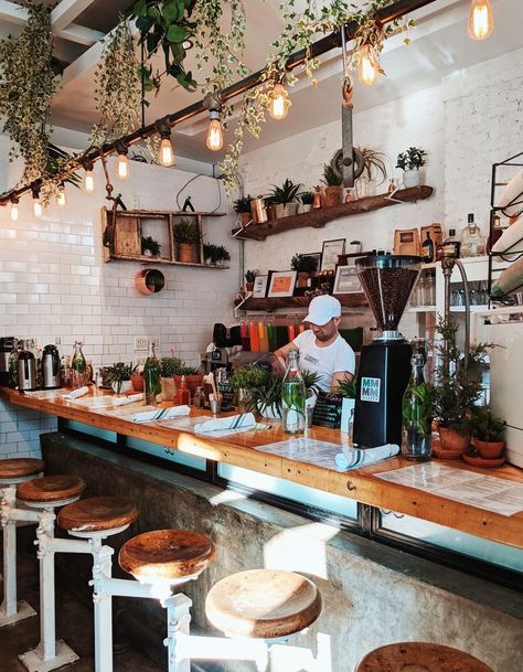 Coffee Shop Lighting Design, Brunch Shop Design, Small Brunch Restaurant Design, White And Wood Coffee Shop, Greenery Coffee Shop, Coffee Shop Accent Wall, Coffee Shop Shelving, Coffee Shop Shelves, Small Cafe Ideas