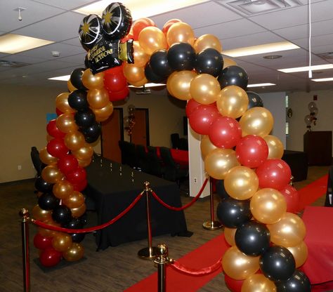 Hollywood party ideas! Balloon arches! Red gold and black party ideas! Themed party ideas! Hollywood Theme Balloon Arch, Red Carpet With Balloons, Red Carpet Dance Theme, Hollywood Theme Dance Decorations, Black Gold And Red Party Decorations Hollywood Theme, Hollywood Balloons, Hollywood Party Ideas, Black Party Ideas, Quince Table