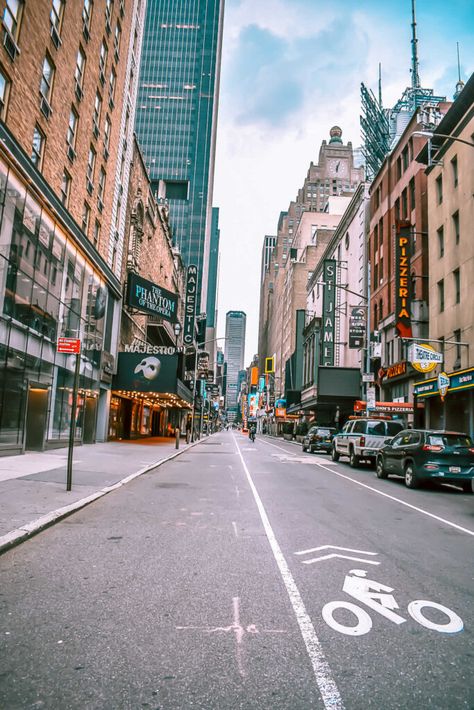 This is an image of West 44th Street at the corner of 8th Avenue in New York City looking east. The marquee at the Majestic Theater for Phantom of the Opera on Broadway in NYC is visible.