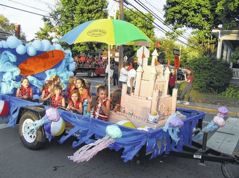 With a theme of “Seaside Paradise,” the floats and parade units were appropriately bathed in sunshine Thursday evening for the annual Wilmington City Schools Homecoming Parade. Participants — and there were many — made use of sunglasses, nose sunblocks, beach towels, inflatable or handmade palm trees, Hawaiian leis, beach balls, and, well you get the [...] Kids Parade Floats, Holiday Parade Floats, Parade Float Theme, Halloween Parade Float, Mermaid Float, Carnival Floats, Tailgate Ideas, Beach Floats, Homecoming Floats