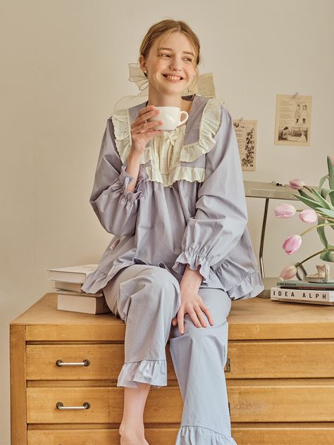 Editor's Notes The pajamas are in a subtle lavender color and have rose lace accents. The shirring at the front center lace accentuate the pajamas' elegant and feminine mood. - Collar and lace on both sides of the lace- ULLALA's unique lovely and soft mood- 30 count cotton fabric for soft texture*Additional price for the gift box, choose between getting it wrapped or getting a kit to wrap it yourselfMeasurements(in.)ONE SIZETop- Total Length: 25.91 in. - Shoulder: 15.35 in. - Chest: 20.67 in. - Bottom Hem: 30.31 in. - Sleeve Length: 21.06 in. - Armhole: 8.86 in.  Bottom - Total Length: 36.61 in. - Waist (banding): 12.8 in. - Hips: 21.06 in. - Thigh: 12.8 in. - Front Rise: 11.81 in. - Back Rise: 16.73 in. - Bottom Hem: 9.06 in. Model info: Camilla - Top 44 (XS), Bottom 44 (XS Rose Lace, Lavender Color, Soft Textures, Pajamas, Lavender, Cotton Fabric, Two Piece, Gift Box, Sleeve Length