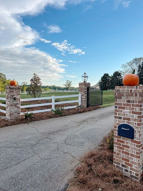 All Your Lighting Questions Answered ￼￼ - Allie Crowe Driveway Entrance With Brick Columns, French Country Driveway Entrance, Farmhouse Long Driveway, Land Entrance Ideas, Property Gate Ideas, Brick Gate Entrance Driveway, Private Driveway Entrance, Estate Entrance Design, Farmhouse Front Yard Ideas