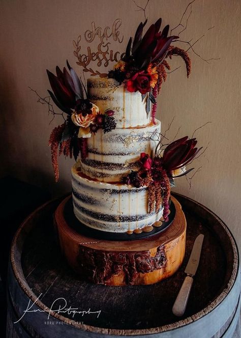 We had a naked wedding cake with dark maroon and orange florals, twigs and a custom wooden cake topper. Witchy Wedding Cake, Wedding Cake With Gold Foil, Wedding Cake With Gold, Witchy Wedding, Halloween Wedding Cakes, Cake With Gold, Wooden Cake Topper, Boho Goth, Wooden Cake