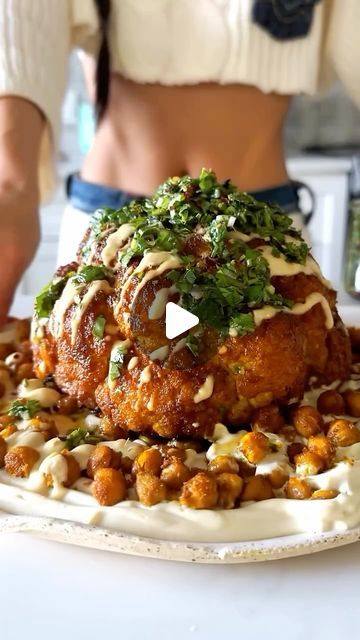 Vegan Recipes on Instagram: "🌱recipe below 👇 follow for more!

By: @veganbunnychef Whole Roasted Turmeric Cauliflower 🧡 with Whippee Tofu Feta, Crispy Curried Chickpeas & Chimichurri sauce 😋🌿

Your holiday centerpiece dish with looooads of flavor 🙌🏼 this whole roasted cauli is so festive, packed with layers of textures & flavors, and super easy to make. Super high in plant protein plus it’s GF 🥰

Btw how is it possible that we still don’t have a cauli emoji 🥹

🧡TO MAKE:
1 whole head cauliflower
1/4 cup olive oil
2 tbsp coconut amino
1 tsp cumin
1 tsp coriander
1/2 tsp turmeric
1/2 tsp onion powder
1/4 tsp paprika

For the chimichurri-
1 cup chopped parsley
2-3 garlic cloves
1 tbsp oregano
1-2 tbsp red wine vinegar depending on your preference
Enough extra virgin olive oil to cove Whole Cauliflower Recipes, Vegan Kfc, Cold Slaw, Curried Chickpeas, Tahini Sauce Recipe, Turmeric Cauliflower, Tofu Feta, Roasted Cauliflower Recipes, Whole Roasted Cauliflower