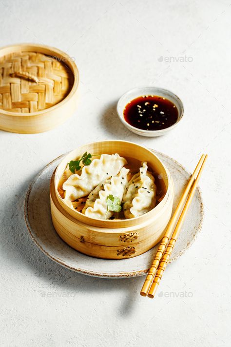 Delicious dumplings in bamboo steamer with sauce and chopsticks by Vell. Delicious dumplings in bamboo steamer with sauce and chopsticks. Selective focus. #AD #bamboo, #steamer, #Delicious, #dumplings Dumpling Steamer, Bamboo Steamer, Editable Newsletter Templates, Chopsticks, Dumplings, Hummus, Camembert Cheese, Sauce, Cheese