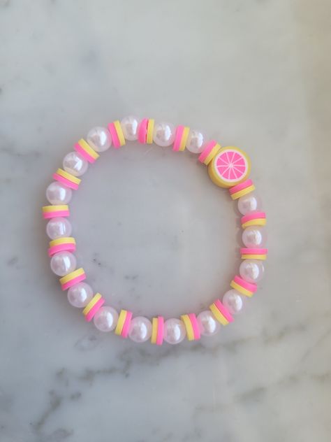 Pink lemonade bracelet stretchy perfect accessory for your outfit Cute Pink Bracelets, Clay Bracelet Idea, Cute Bracelets To Make, Pulseras Aesthetic, Smile Bracelet, Make Clay Beads, Bracelet Business, Colorful Bead Bracelets, Clay Bracelets