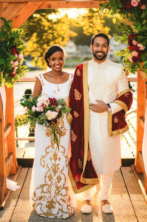 Ethiopian Pakistani wedding at the Riverview at Occoquan in VA. The bride and groom chose to wear their traditional cultural attire and we LOVED it! Visit the blog for more amazing photos from this intercultural wedding. Blindian Wedding, Ethiopian Wedding Decoration, Ethiopian Buna Ceremony, Traditional Habesha Kemis For Festive Wedding, Blindian Couples, Traditional Embroidered Habesha Kemis For Wedding, Intercultural Wedding, Interracial Indian Wedding, Ethiopian Wedding Dress