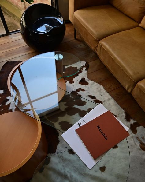 Choosing pieces for our studio’s meeting room was a joy for the sake of interior design that is a huge part of identity of House of Rowdy. Each item, from the cozy tan leather sofa to the unique glass-top coffee table, was selected to create a space where creativity thrives. The abstract artwork by @rosemadone and cowhide rug is to add a touch of rustic charm, blending with the modern aesthetic of our industrial space. Every detail is to reflect our passion for design and the pleasure of cra... Cowhide Rug Living Room, Tan Leather Sofa, Tan Leather Sofas, Hangout Spot, Industrial Space, Glass Top Coffee Table, Cowhide Rug, Cow Hide Rug, Cozy Corner