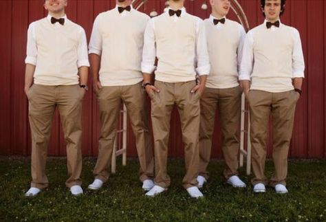 Something fun & different: Beige cotton chinos, cream V-neck sweater vested, white dress shirt with rolled up sleeves, and darker colored bow tie. Groomsmen Outfits Casual, Groomsmen Sweaters, Casual Groomsmen Attire, Casual Groomsmen, Casual Grooms, Vest And Bow Tie, Mens Wedding Attire, Yacht Wedding, Boat Wedding