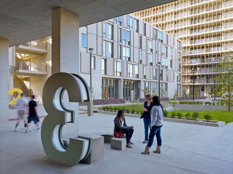 Large numbers identifying the buildings illuminate at night. Signage in the lobby educates students on the buildings sustainable systems. Building Number Signage, Number Signage, Hospital Design Architecture, Student Housing, Student House, Hospital Design, Green Architecture, Construction Industry, The Lobby