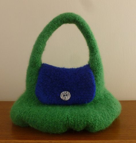 Unique Handmade Handbag Fun & funky felted overarm bag Bright green & blue With handmade ceramic button 27 cm high (base to top of handle) 25 cm wide (side to side at base) 18 cm deep (at base - front to back) Designed & handknitted and felted in Scotland Pure wool - tactile and natural Funky Handbags, Funky Bags, Shopping Bag Design, Felted Handbags, Handmade Handbag, Buy Bags, Vintage Knitting Patterns, Top Handle Bags, Handmade Handbags