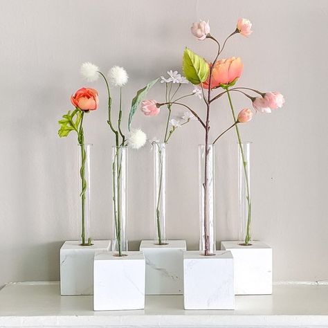 We made these Test Tube Vases for the mantel in our daugher's first apartment. She wanted a faux marble base for the vases, so we used the technique we've previously used for the faux technique. We rather made this up as we went along, having to improvise along the way. But we were all thrilled with the end result. Here’s what we used to make the test tube vases: Test Tubes, 25mm by 200mm 3″ Wood BlocksWhat You’ll Need To Marbleize the BlocksAcrylic paint for the base color of the bl… Faux Marble Countertop, Test Tube Vase, Unique Garden Art, Easy Diy Decor, Striped Vase, Tube Design, Test Tubes, Craft Decor, Elegant Centerpieces