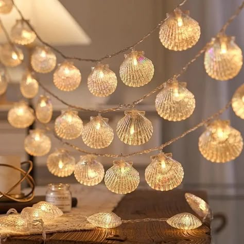 Add a touch of the ocean to your living space with these pretty indoor Iridescent Sea Shell Fairy Lights. Designed to illuminate your space with a soft, romantic glow, they are perfect for creating a cosy and cute ambiance. These lights are ideal for decorating your bedroom, dorm or living room. Available in 1.5m, 3m, 6m or 10m lengths Warm white colour to create a welcoming glow Battery or USB Indoor Christmas Tree Lights, Beach Theme Bedroom, Ocean Room Decor, Shell Light, Beachy Room Decor, Lights For Christmas, Party Bedroom, Ocean Room, My Safe Space