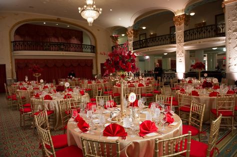 Overall view of this stunning red and gold table design - alternating rose centerpieces, red napkins, gold chiavari chairs with red cushions. Photography by www.freedphoto.com Red And Rose Gold Quince Theme, Wine Red And Gold Quinceanera Theme, Red And Gold Quinceanera Decorations Ideas, Red And Champagne Quinceanera Decorations, Red And Gold Quinceanera Theme Decorations, Red White And Gold Quinceanera Ideas, Quincera Themes Ideas Red And Gold, Red And Gold Theme, Champagne And Red Quinceanera Theme