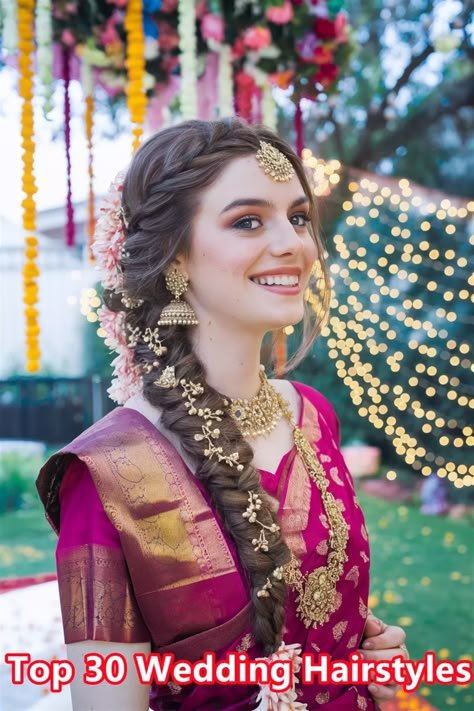 Discover the charm of elegant South Indian wedding hairstyles that are sure to turn heads on your special day. This stunning hairdo, featuring intricate braids adorned with fresh jasmine flowers, embodies the rich cultural heritage and beauty of South Indian traditions. Perfect for brides who wish to blend tradition with modern elegance, this hairstyle radiates grace and sophistication. Explore the endless possibilities for your wedding hairstyles! #weddinghairstyles #SouthIndianHairstyles Side Braid Hairstyles Indian Wedding, South Hairstyles Indian Weddings, Wedding Lehenga Hairstyles, Wedding Function Hairstyles Indian, Traditional Bride Hairstyle, Bridal Hairstyle Indian Wedding Braids, Indian Hair Wedding, Wedding Braid Indian, Braided Hairstyles For Bride Indian