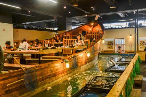 Zumo fishing restaurant where guests sit on a boat above fishing tanks where you fish for your own lunch Boat Restaurant Design, Boat Restaurant, Boat Furniture, Adventure List, Boat Theme, Egyptian Home Decor, Modern Restaurant Design, China Restaurant, Themed Cafes