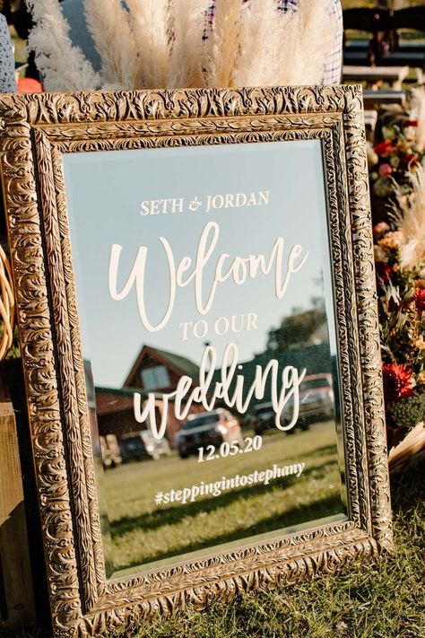 Framed glass wedding ceremony sign Orange Blossom Bride | Orlando Wedding Blog #orlandowedding #sunnyacreslodge #bohowedding #rusticwedding #westernboho Glass Frame Wedding Sign, Wedding Signs Glass Frames, Wedding Glass Sign, Glass Wedding Sign Diy, Welcome Ceremony Sign, Wedding Welcome Sign Frame, Western Wedding Welcome Sign, Boho Welcome Sign Wedding, Glass Wedding Sign