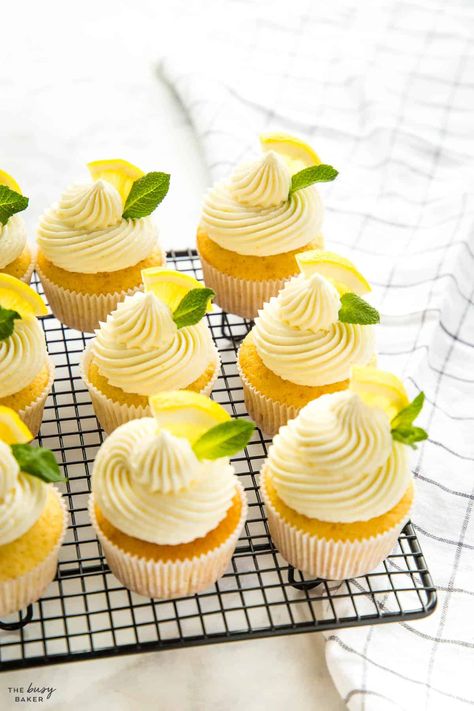 This Lemon Cupcakes Recipe is the perfect light and fresh summer dessert. A tender lemon cupcake with sweet & creamy lemon buttercream frosting. Recipe from thebusybaker.ca! #lemoncupcakes #lemoncupcakesrecipe #lemoncupcakerecipe #easylemoncake #easylemoncupcakes #lemondessert #lemon #easydessert #dessertrecipe Lemon Buttercream Frosting, Lemon Cakes, Lemon Dessert, Lemon Buttercream, White Frosting, Pumpkin Recipes Dessert, Lemon Cupcakes, Cooling Rack, Cooking Classy