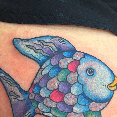 Kate Schmelter on Instagram: "Another rainbow fish ✨" Rainbow Fish Tattoo, Ocean Sleeve, Snow Flake Tattoo, Uv Tattoo, Water Tattoo, Cartoon Character Tattoos, Fish Tattoo, Rainbow Fish, Cartoon Tattoos