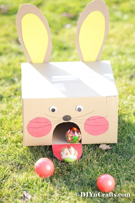 Turn an ordinary cardboard box into this adorable Easter bunny cardboard box ball game in just a few minutes! An ideal family-friendly Easter game DIY. #EasterBallToss #EasterBallGame #EasterGame #DIYBallToss #DIYEasterBunnyGame Bunny Cardboard, Easter Outdoor Games, Easter At Home, Fun Easter Games, Easter Games For Kids, Easter Party Games, Easter Outdoor, Easter Festival, Easter Games