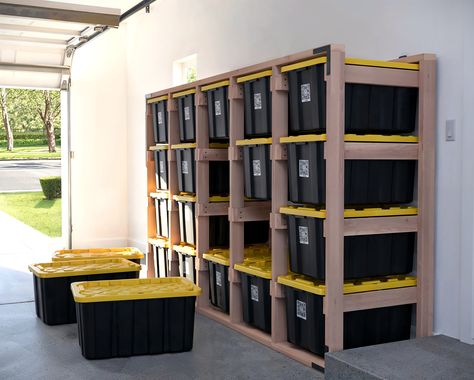 DIY 5x4 Tote Storage Rack in a garage, holding 20 totes, with a woman sitting on one tote. Easy-to-follow digital download plans available on Etsy. 27 Gallon Tote Storage, Diy Wood Counters, Garage Storage Bins, Wood Counters, Garage Storage Plans, Mobile Garage, Bin Rack, Garage Workshop Layout, Garage Storage Inspiration