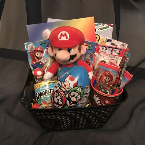 Super Mario Bros Gift Ideas, Mario Easter Basket, Mario Gift Ideas, Super Mario Bros Gifts, Basket Themes, Super Mario Gifts, Easter Basket Themes, Candy Themed Party, Holiday Baskets