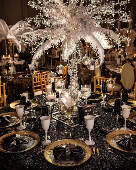 a sophisticated 1920s tablescape with a black sequin tablecloth, gold chargers and black napkins, a tall feather centerpiece Themed Rehearsal Dinner Ideas, 21st Party Themes, Christmas In Las Vegas, Great Gatsby Decorations, Gatsby Decorations, Themed Rehearsal Dinner, Great Gatsby Prom, The Great Gatsby Theme, Gatsby Birthday Party