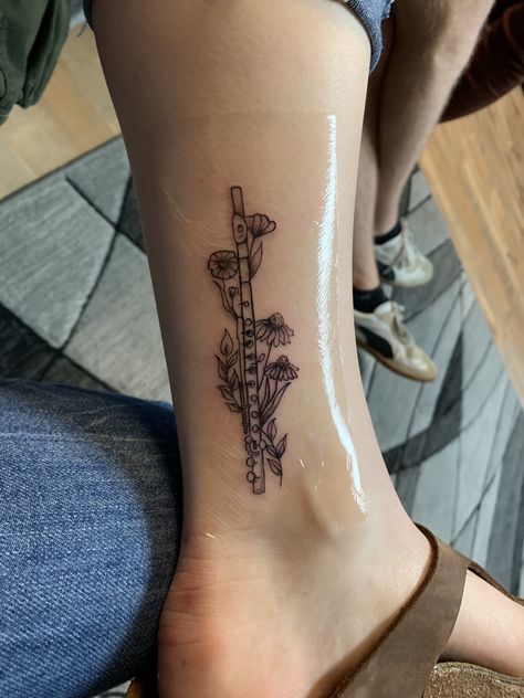 Flute tattoo Music Staff Tattoo, Flute Tattoo, Small Music Tattoos, Tattoo Music, Ankle Tattoo Designs, Marquesan Tattoos, Music Tattoo Designs, Music Tattoos, Discreet Tattoos