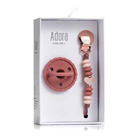 The Adora Baby Gifts Pacifier Set - The favored pacifier by mom’s and babies alike. With its natural soft and flexible silicone material it provides the feel of mom, allowing the baby to self-soothe and remain calm. The Adora Baby Gifts pacifier’s iconic one-piece design assures the safety and cleanliness of the product. Capture the pure infant look with these lovable paci styles. Doona Stroller, Baby Soother, Teething Stages, Baby Boy Booties, Newborn Pacifier, Baby Wishlist, Remain Calm, Comfort Gifts, Layette Set