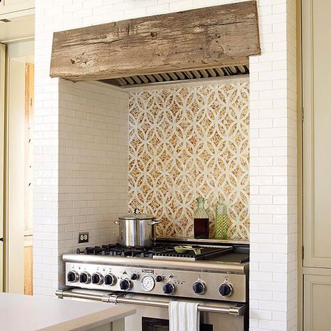 Whimsical tile for your range's backsplash brings energy and personality to your kitchen! More backsplash ideas: http://www.bhg.com/kitchen/backsplash/behind-the-range-tile-backsplash/?socsrc=bhgpin092713backsplashfocalpoint&page=1 Tiled Niche, Cooking Fireplace, Range Tile, Beadboard Backsplash, Southern Design, Herringbone Backsplash, Diy Backsplash, Casa Vintage, Kitchen Hoods