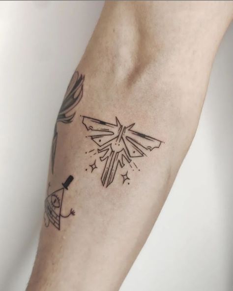 Last Of Us 2 Tattoo Ideas, Small The Last Of Us Tattoo, Small Nerd Tattoos, Ellie's Tattoo The Last Of Us, Look For The Light Tattoo Tlou, Ellie Williams Tattoo Ideas, Tattoo Ideas The Last Of Us, Tlou Firefly Tattoo, Game Inspired Tattoos