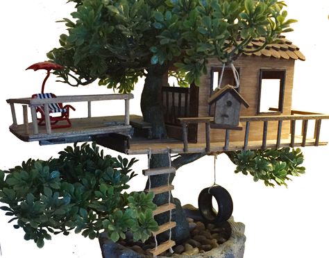 A treehouse built from scratch using basswood and balsa wood, in addition to popsicle sticks and other materials. Treehouse Miniature, Treehouse Craft, Miniature Tree House, Fairy Tree Houses, Fairy Garden Plants, Tree House Diy, Vertical Garden Design, Fairy Garden Designs, Fairy Garden Crafts