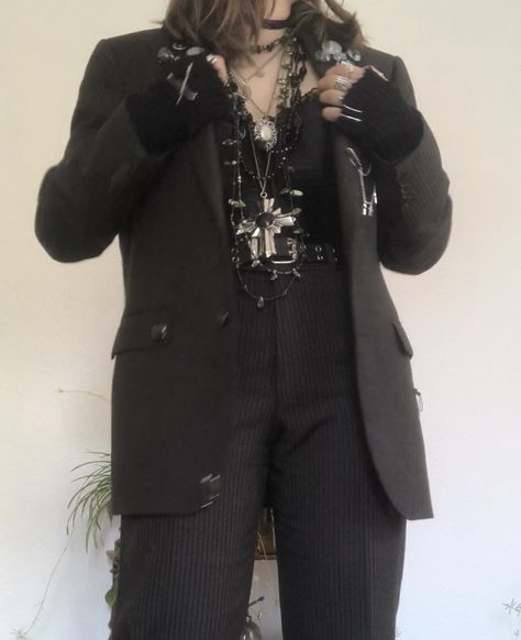 A mid-sized person/girl grey/dark green striped suit decorated with lots of oins and chains, black arm warmers, black platform dr. Martens and multiple crystal rings and bracelets. 		The person is also wearing multiple silver necklaces, a big one in form of a cross. Alt Formal Wear, Emo Prom Suit, Formal Alternative Outfit, Alt Formal Outfits, Corset Suit Outfit, Alt Suit, Grunge Suit, Crowcore Fashion, Goth Suit