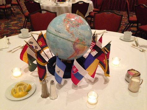 Globe with international flags. Flags are stuck in Styrofoam ring that has been painted blue. Decorations for" Christ for the whole wide world" dinner (or any international themed program). International Party Decorations, International Party Theme, Dinner Template, International Decor, Dinner Party Ideas, Around The World Theme, International Party, Prom Themes, Travel Party Theme